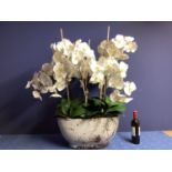 A large impressive faux flowers decorative statement piece, of white orchid arrangements, in large