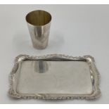 A Victorian sterling silver beaker together with a small oblong silver card tray with cast scrolling