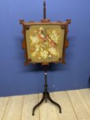 A good large Victorian carved mahogany fire screen inset with glazed needlepoint of a Cromwellian