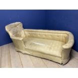 A Victorian bath shaped Chaise Longue , with buttoned arms and back and original ivory silk