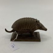 Regency bronze inkwell, modelled as an armadillo, please note the one remaining glass inkwell is
