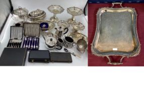 A large oblong silver plated tray, cast border, chased decoration with loop handles 69 cm x 41 cm,