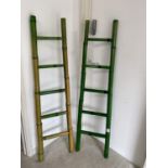 A pair of faux bamboo decorative ladders