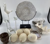 A quantity of decorative items including faux Ostrich eggs, shells, seagull models, fossil type