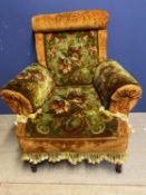 Modern armchair upholstered with carpet style orange and green fabric