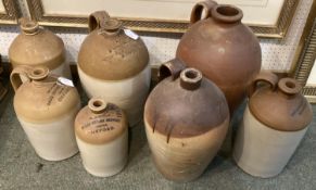 Collection of C19th and early C20th slipware flagons, most with names to top to include Halls