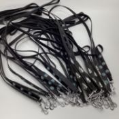 A quantity of leather decorated dog leads etc