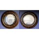 Pair of modern circular porthole style mirrors, bevelled plate with metal bound faux leather frames,