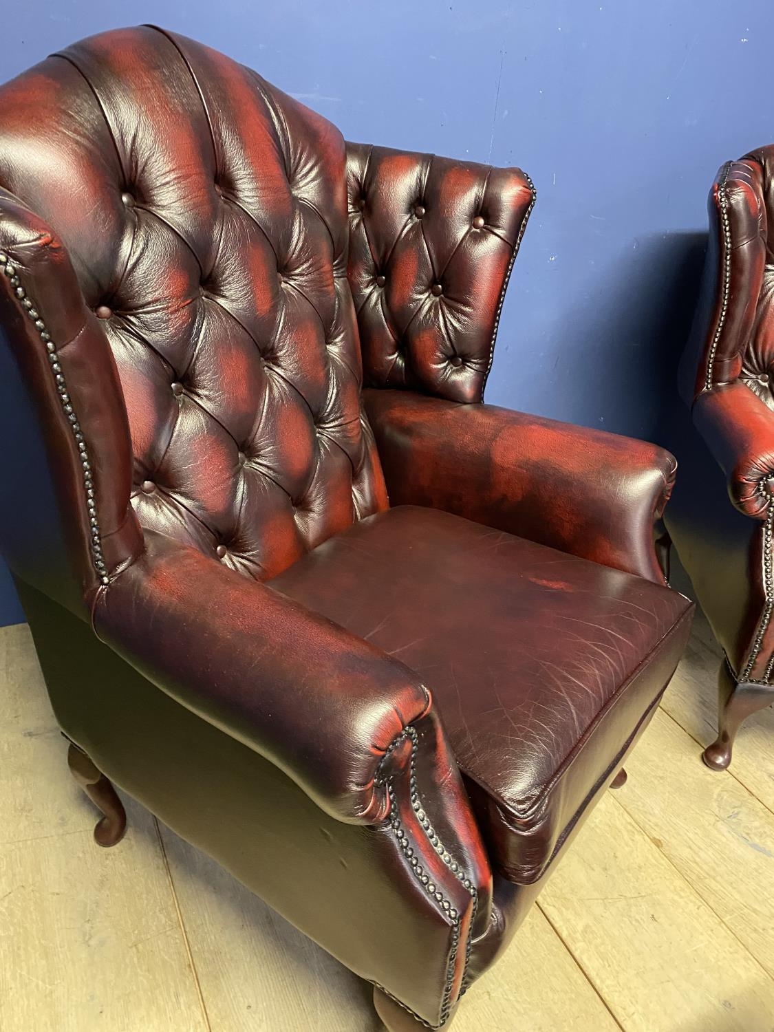 Pair Red/Brown OXBLOOD Thomas Lloyd leather winged arm chairs and 2 pouffes/Stools. SEE ALL PHOTOS - Image 2 of 3