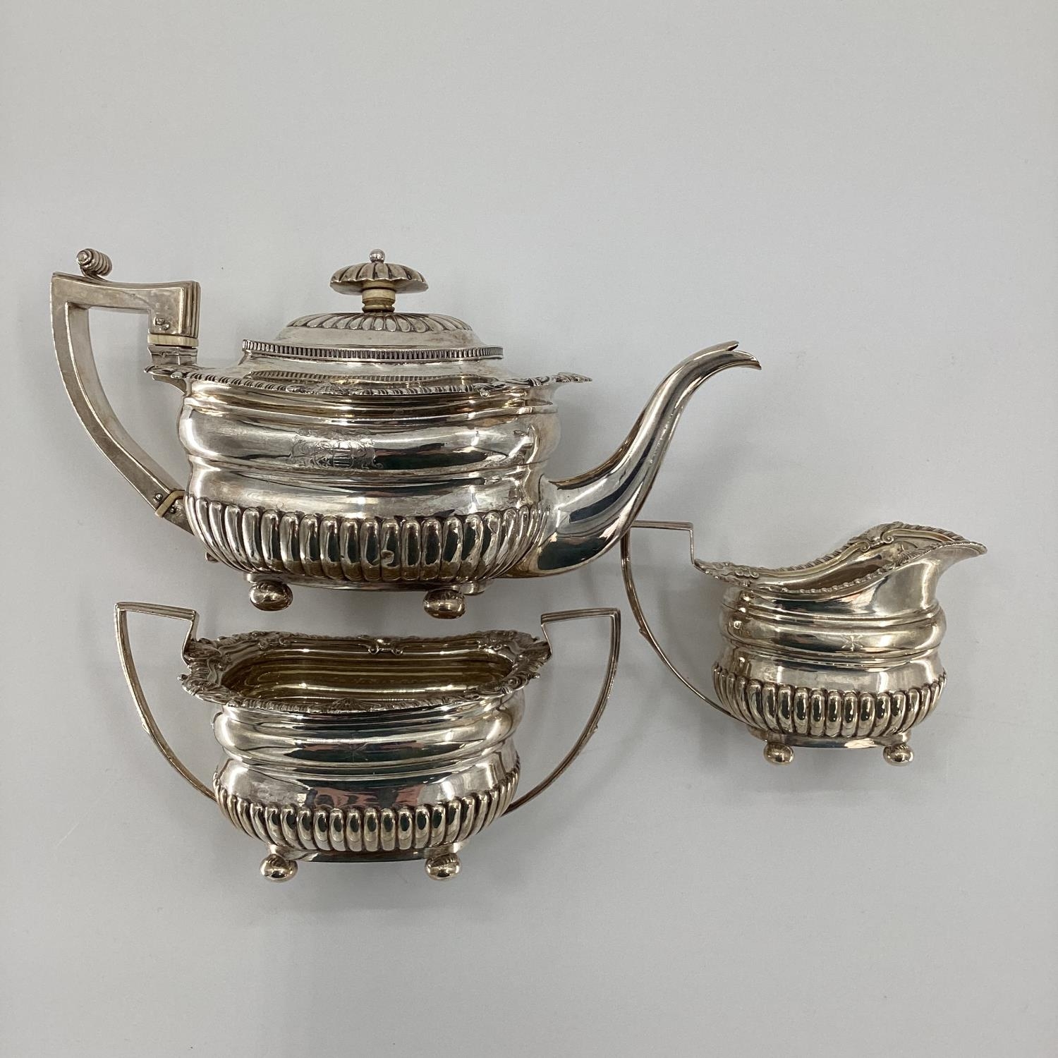 A sterling silver 3 piece tea set of half reeded design by JW Story and W Elliot, Lon - Image 2 of 8