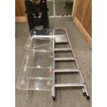 Pair of Perspex side tables, and two step ladders