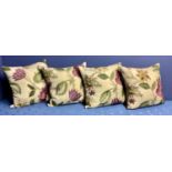 A set of four bespoke good silk and velvet cushions, decorated cream ground and purple and green