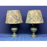 Pair of modern green bulbous and ornately carved lamps, with OKA pleated shades