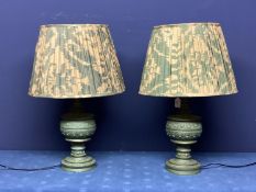 Pair of modern green bulbous and ornately carved lamps, with OKA pleated shades