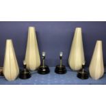 Four similar small black lamps, with modern tall conical style cream shades