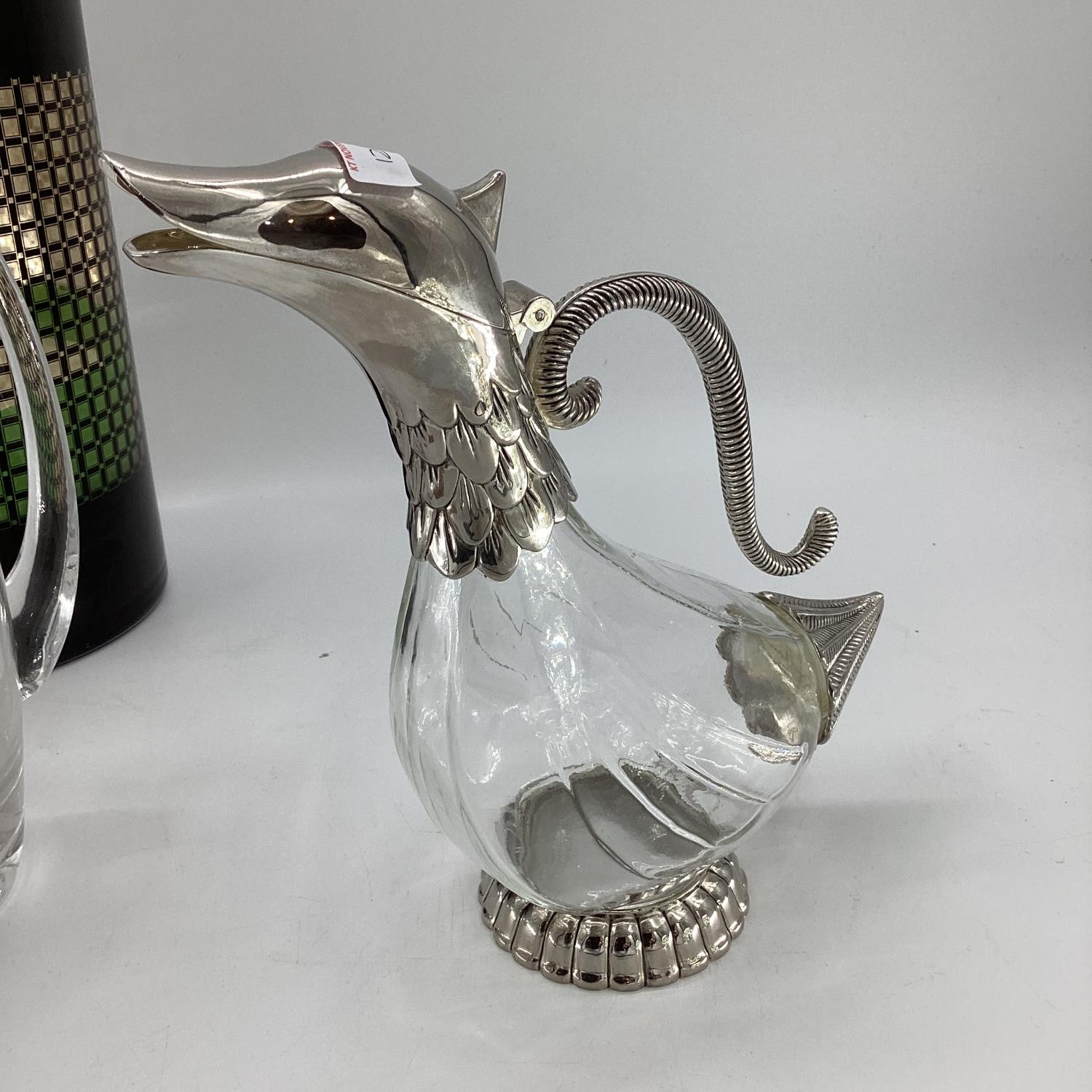 A quantity of glass jugs, including a decorative glass jug with silver plated head and tail styled - Image 4 of 10