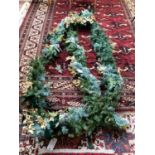 CHRISTMAS: Door garland, with white poinsettia, pine cones, and gold coloured holly, Green Ribbons