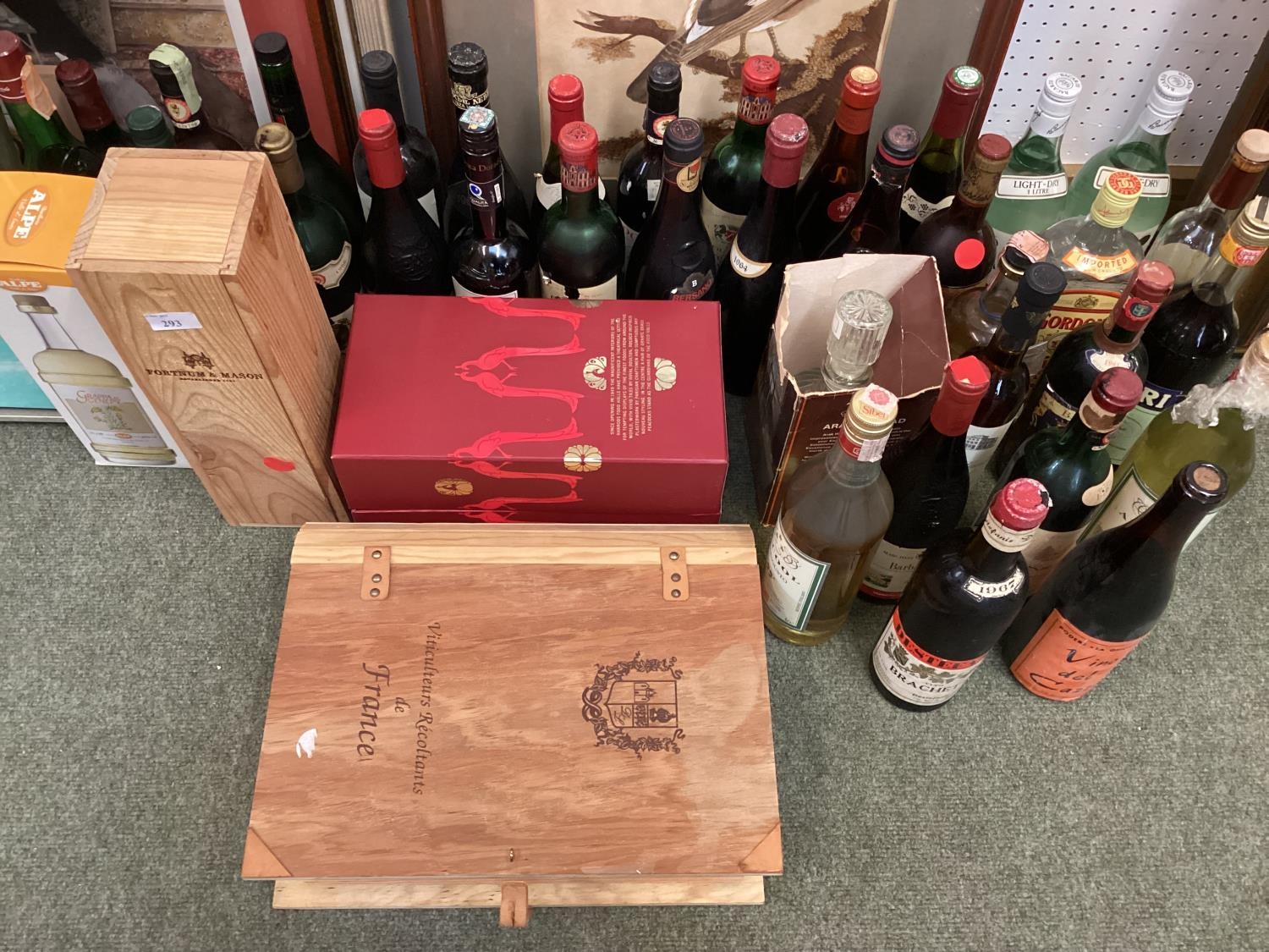 A boxed Fortnum and Masons bottle of Port, and other various bottles, all as found from house