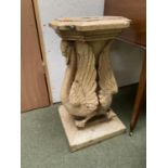 Reconstituted stone garden plinth, modelled as two opposing swans (some losses and wear) 70cm H