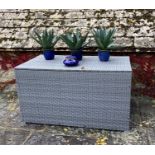 GARDEN FURNITURE: a very large grey faux rattan/all weather garden storage chest, some minor wear,