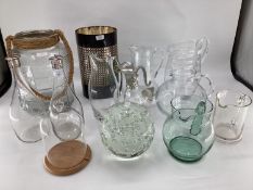 A quantity of glass jugs, including a decorative glass jug with silver plated head and tail styled