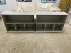 A pair of grey painted low book shelves