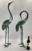 A pair of decorative Verdigris metal cranes, tallest 108cmH