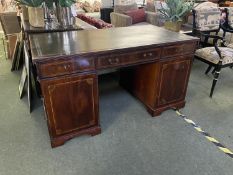 A good quality inlaid and cross banded mahogany twin pedestal writing desk, with three drawers and