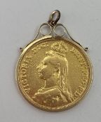 An 1887 £2 gold coin in a 9ct bezel mount 17.36g