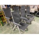 GARDEN FURNITURE: a set of grey and black folding garden chairs