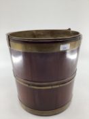 A good mahogany and brass bound bucket, wit brass liner and carrying handle, 32cm H