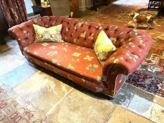 A good Victorian Chesterfield sofa, in a contemporary terracotta ground upholstery, fully buttoned ;