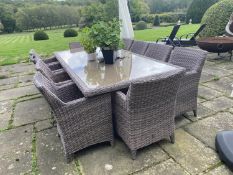 GARDEN FURNITURE: A good Garden table and chairs set, 10 armchairs and cushions, and glass inset
