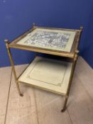 Two tier brass and gilt side table, inset with dominos style patterned counters