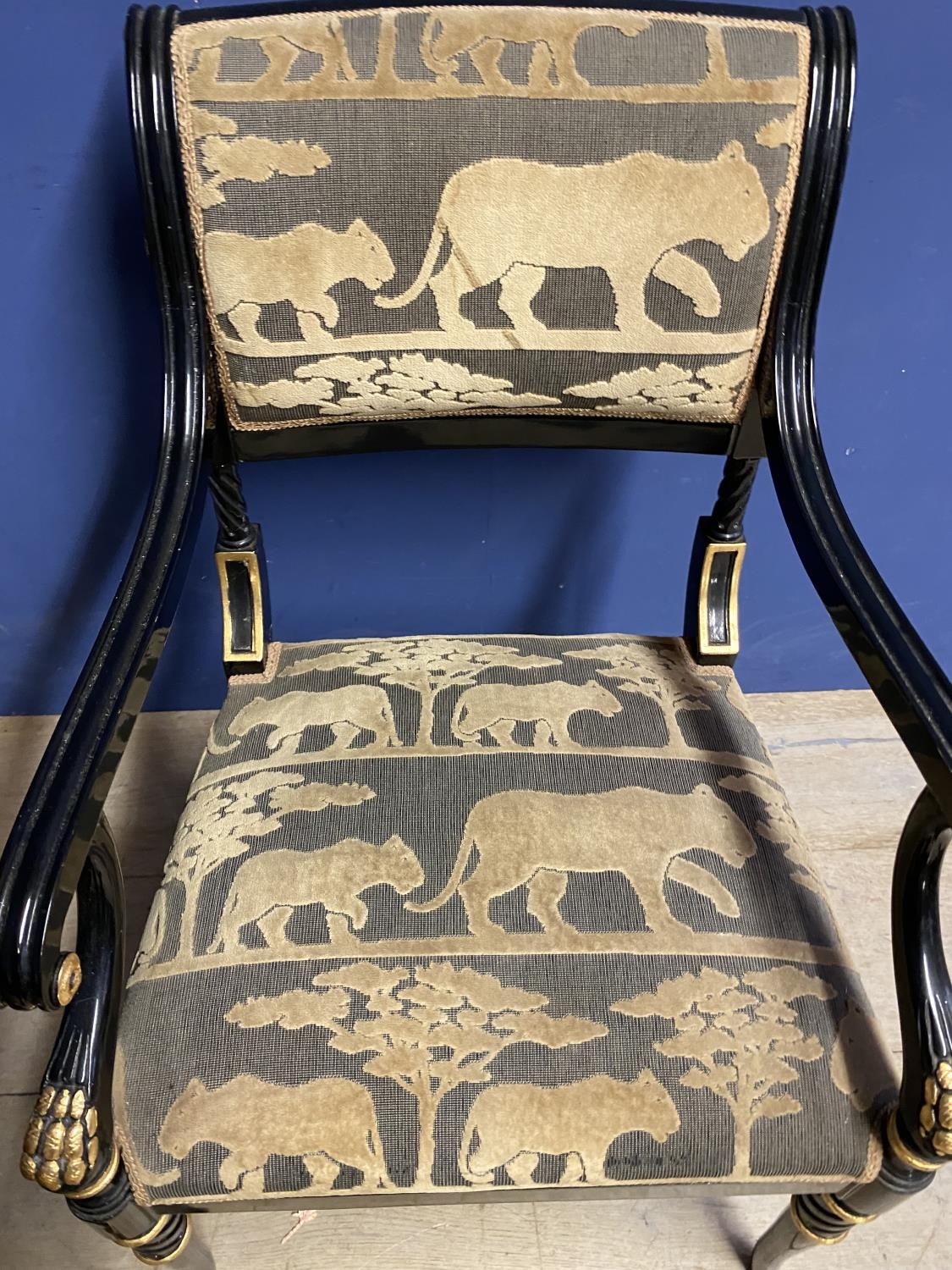 Pair of contemporary black and gilt armchairs, upholstered in an African Safari upholstery, one - Image 4 of 5
