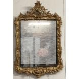 A George III giltwood pier mirror last quarter of C18th, pierced scrolling top, to a shaped