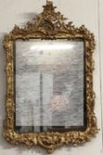 A George III giltwood pier mirror last quarter of C18th, pierced scrolling top, to a shaped