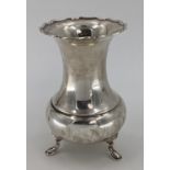 A sterling silver flower vase of bulbous form with flared rim raised on three feet by Atkin Bros