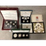 A collection of silver and white metal commemorative coins to include silver proof examples.