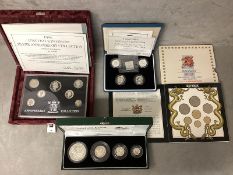 A collection of silver and white metal commemorative coins to include silver proof examples.