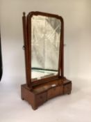 Mahogany dressing table swing mirror and three drawers to base