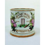 Cricket mug/cup. A white ceramic mug with central image of a cricket wicket, bat and ball with