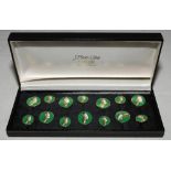 Cricket buttons. A set of seven larger and seven smaller cricket buttons each depicting a batsman at