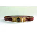 Cricket belt. A wonderfully decorated expanding brass and cord cricket belt and buckle. The gilt