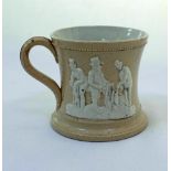Cricket mug. A small Staffordshire 3" waisted cricket mug with strap handle and beaded rim, with