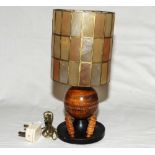Cricket table lamp in the form of a wooden cricket ball mounted on circular base with two bails,