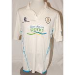 Derbyshire C.C.C. A match worn Derbyshire 1st XI white short sleeve shirt with blue trim, County