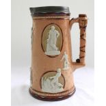 Cricketing jug. A large and impressive Doulton Lambeth stoneware tapering jug, moulded in relief