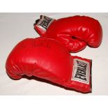 Henry Cooper. 'Everlast' red boxing glove signed in black pen by Cooper. Sold with an unsigned red