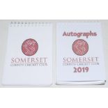 Somerset C.C.C. Two Somerset C.C.C. spiral bound autograph books, each page with individual colour